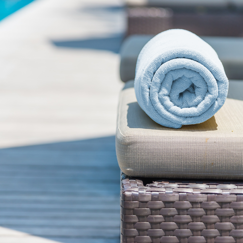 sky blue beach towel on stool