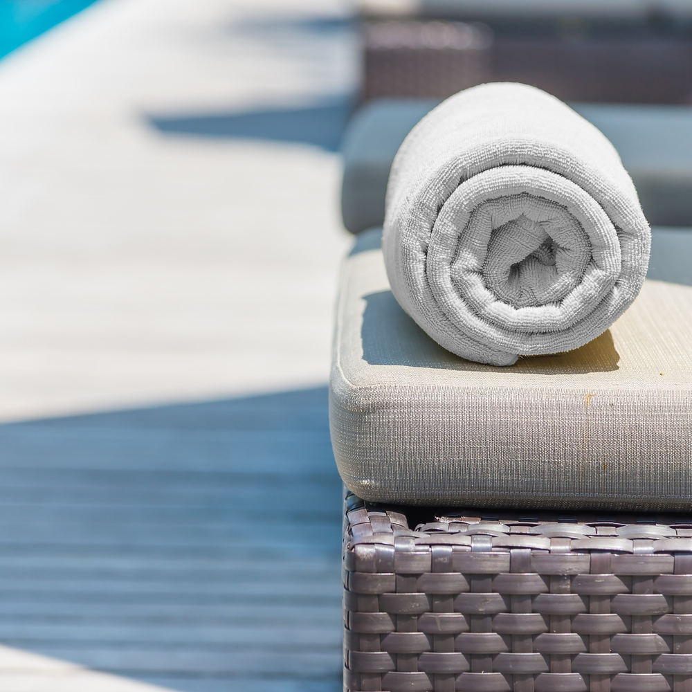 white beach towel on stand